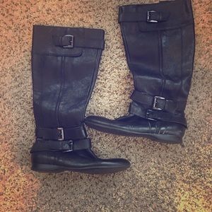 Tall black leather riding boots